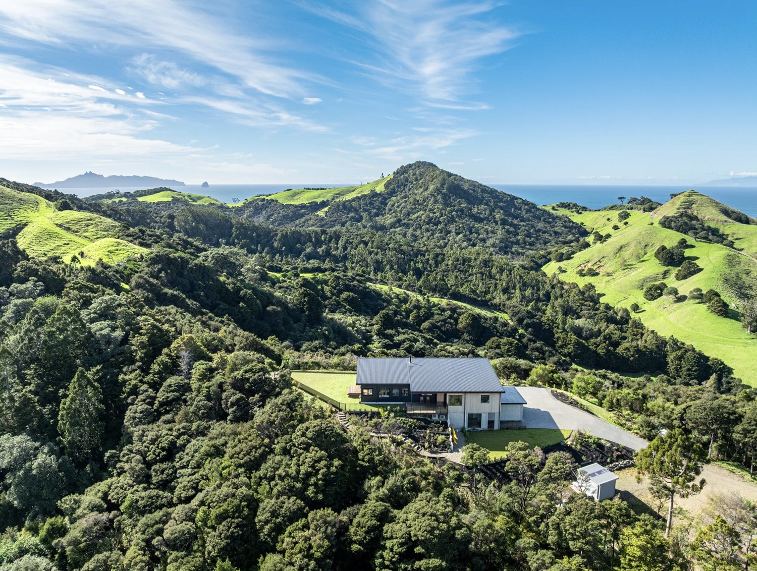 Bream Tail Farm homestead on the ridge with native bush and ocean outlook, 3 Tangaroa Road, Mangawhai Heads